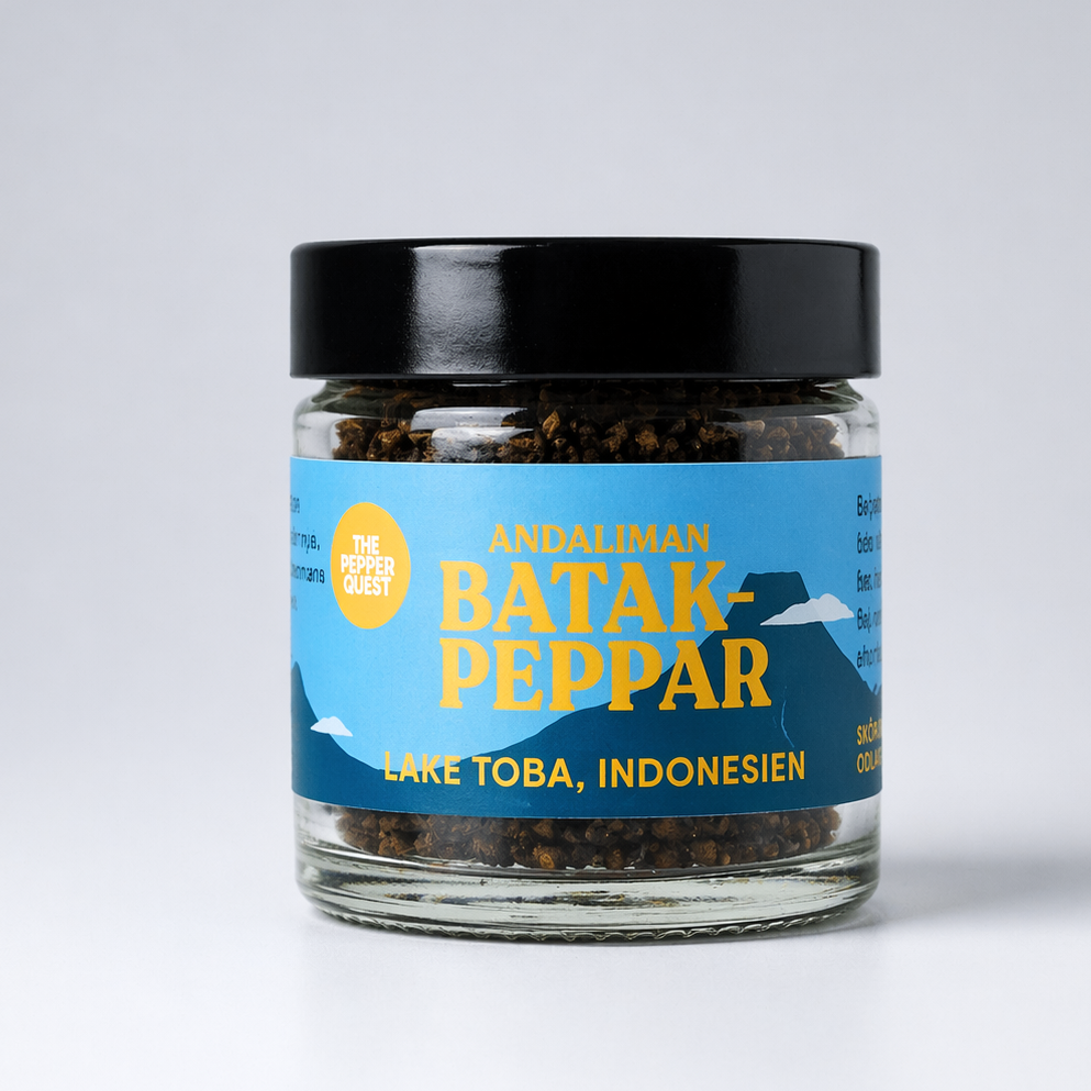 Jar of Batak pepper with a blue label on a white background