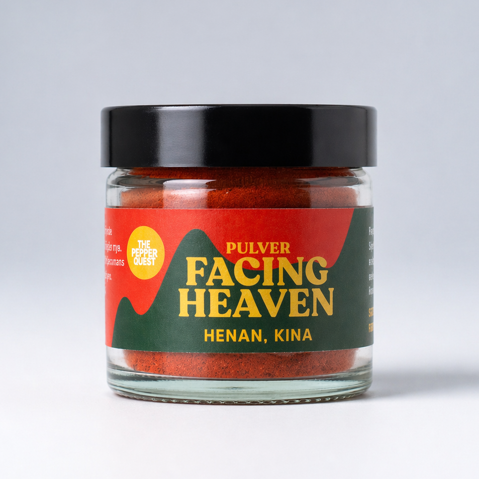 Jar of 'Facing Heaven' powder with a red label on a gray background