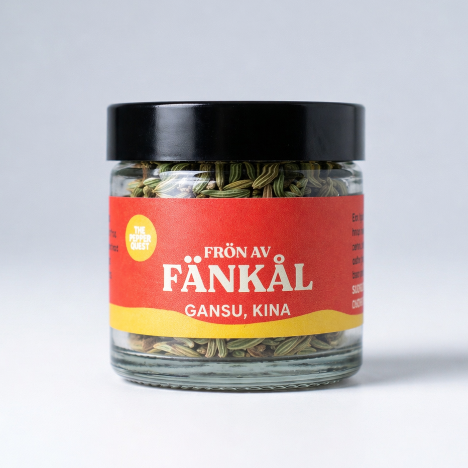 Jar of fennel seeds with a red label on a white background