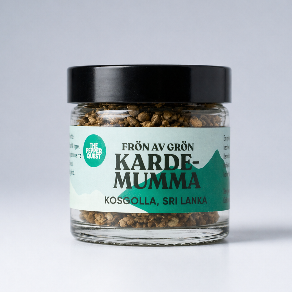 Jar of 'Karde-Mumma' spice with a black lid on a white background
