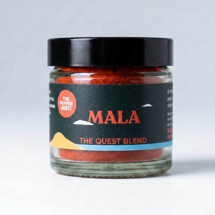 Jar of 'The Quest Blend' MALA on a light gray background