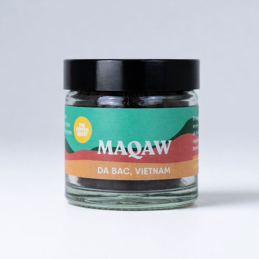 Jar of MAQAW coffee with a colorful label on a white background