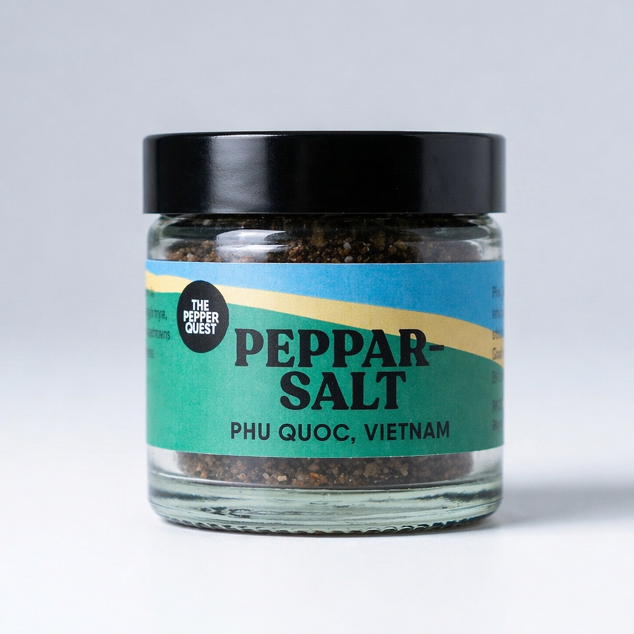 Jar of peppar salt with a black lid on a light gray background