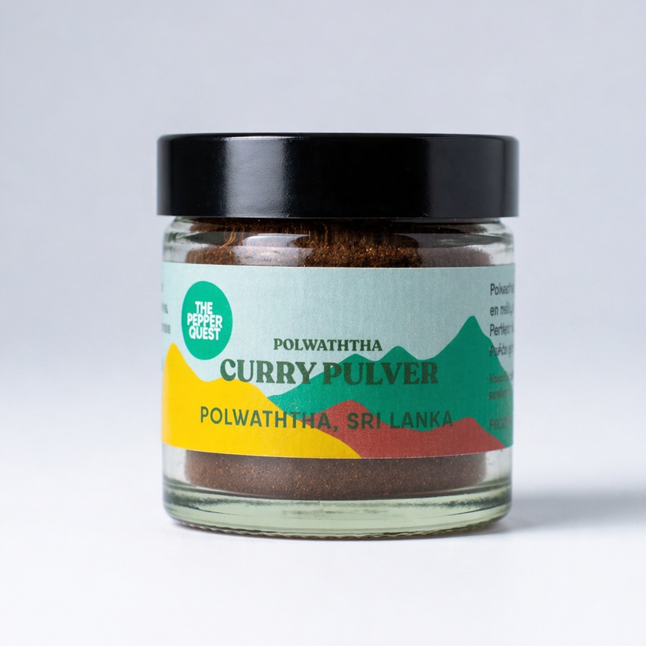Jar of curry powder with a colorful label on a light gray background