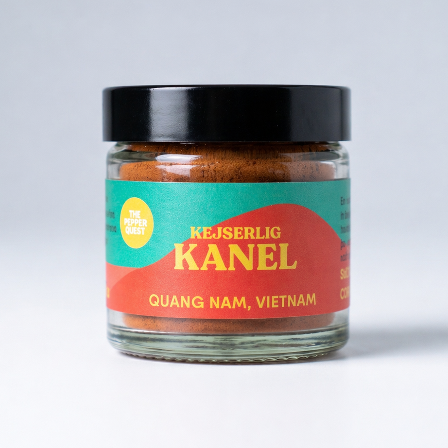 Jar of 'Kejserlig Kanel' spice with colorful label on a white background