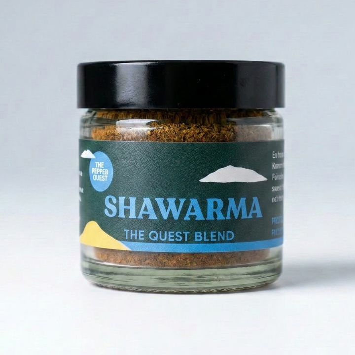 Jar of Shawarma seasoning blend with a black lid on a light gray background