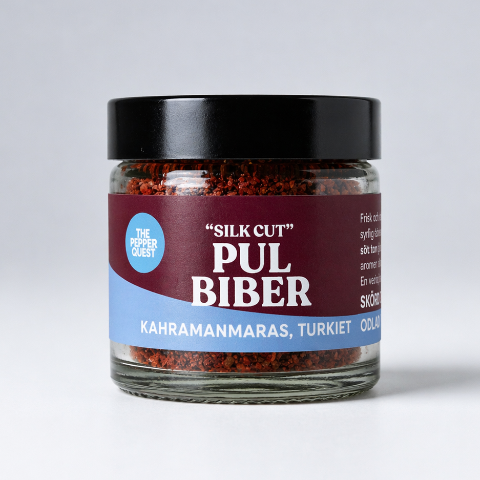 Jar of 'Silk Cut' Pul Biber with a black lid on a light gray background