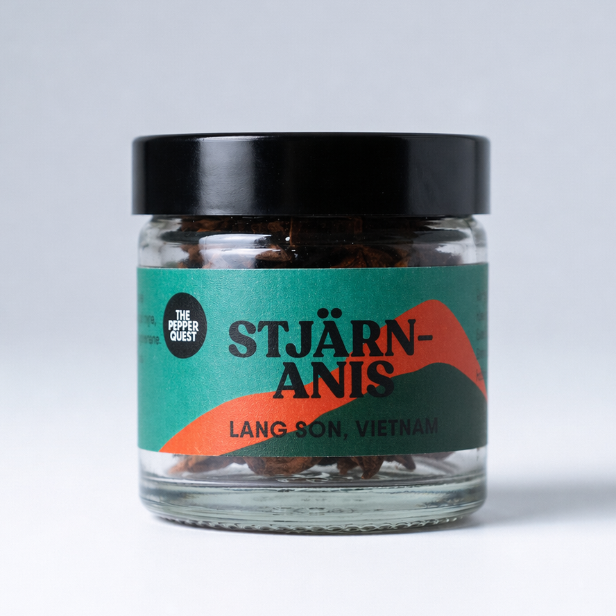 Jar of Stjärnanis with a black lid on a white background