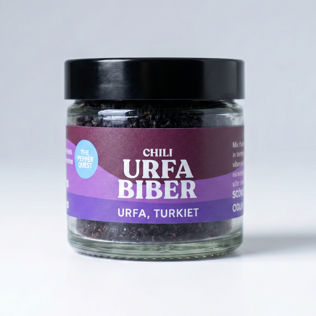 Jar of Urfa Biber chili with a purple label on a white background