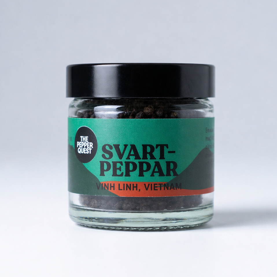 Jar of svart peppar with a green label on a white background