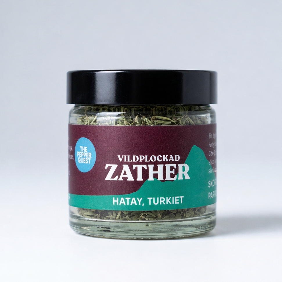 Jar of Zather wild-picked herbs with a purple label on a white background