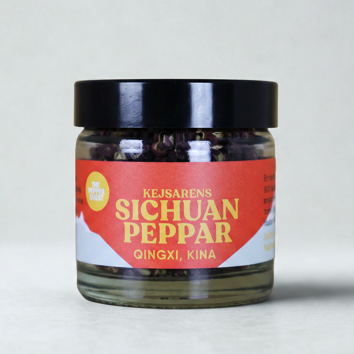 Jar of Sichuan pepper with a red label on a white background