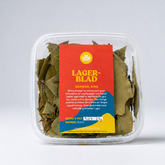 Packaged leafy greens with a red label on a white background