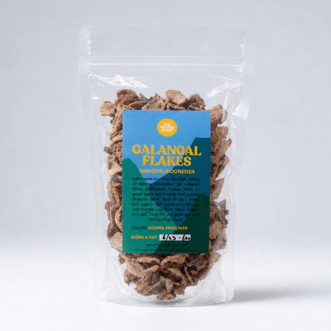 Packaged galangal flakes with a blue label on a white background