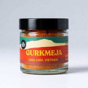 Jar of Gurkmeja with a colorful label on a white background