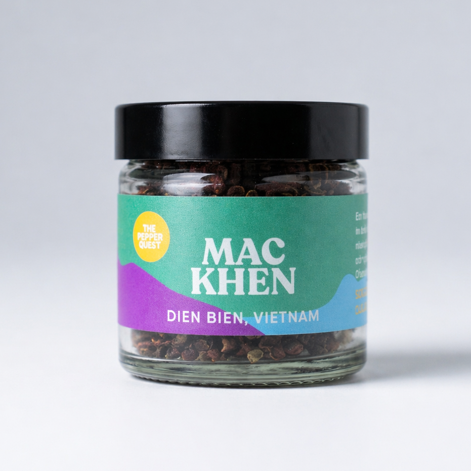 Jar of mac khen with a colorful label on a white background
