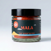 Jar of 'The Quest Blend' MALA on a light gray background