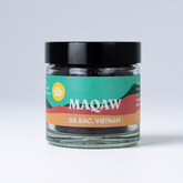 Jar of MAQAW coffee with a colorful label on a white background