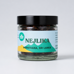 Jar of NEJLIKA cloves with a mountain design on the label against a white background