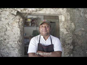 Emanuel makes salsa verde in a traditional molcajete